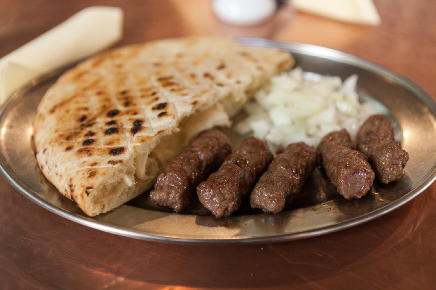 Cevapi or cevapcici, a traditional Bosnian meat dish.